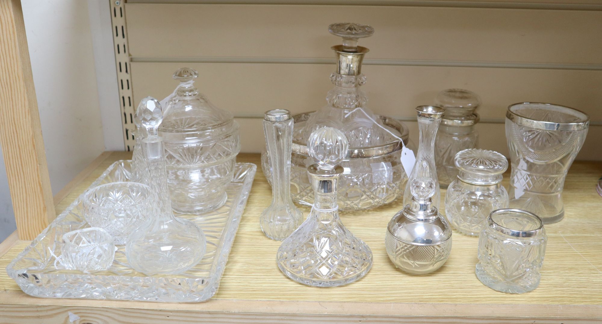 A collection of silver-mounted and other cut glass items,